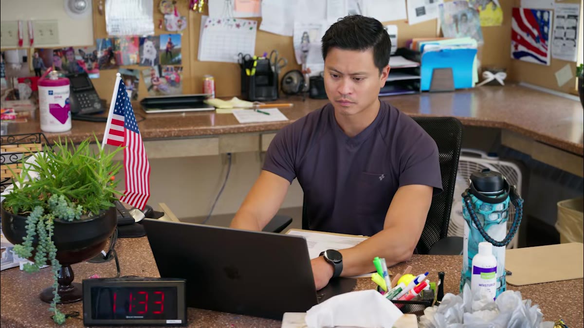 A therapist planning at a desk between patients